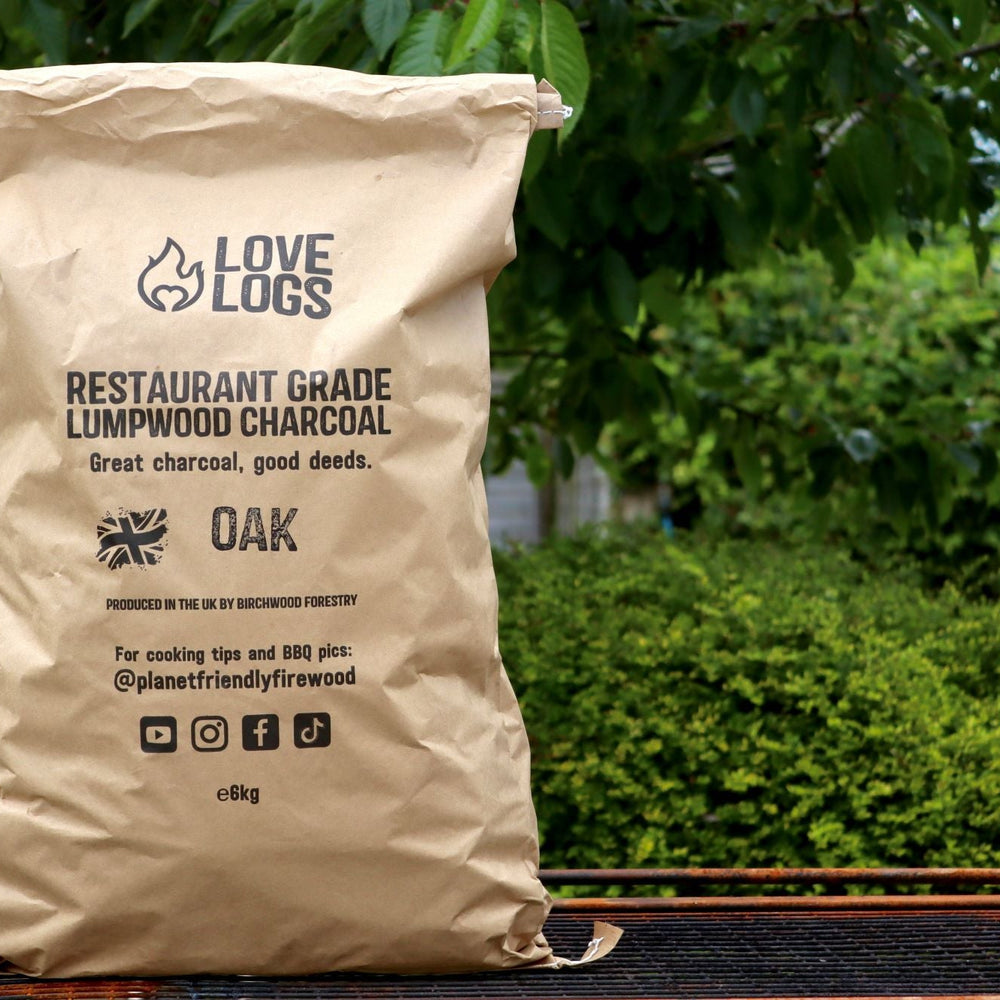 A brown paper bag which reads 'Love Logs Restaurant Grade Lumpwood Charcoal'