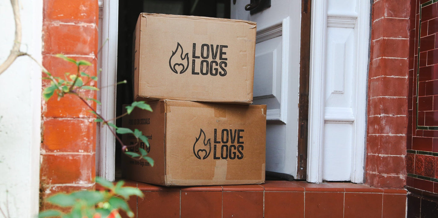 Love Logs cardboard boxes on a doorstep