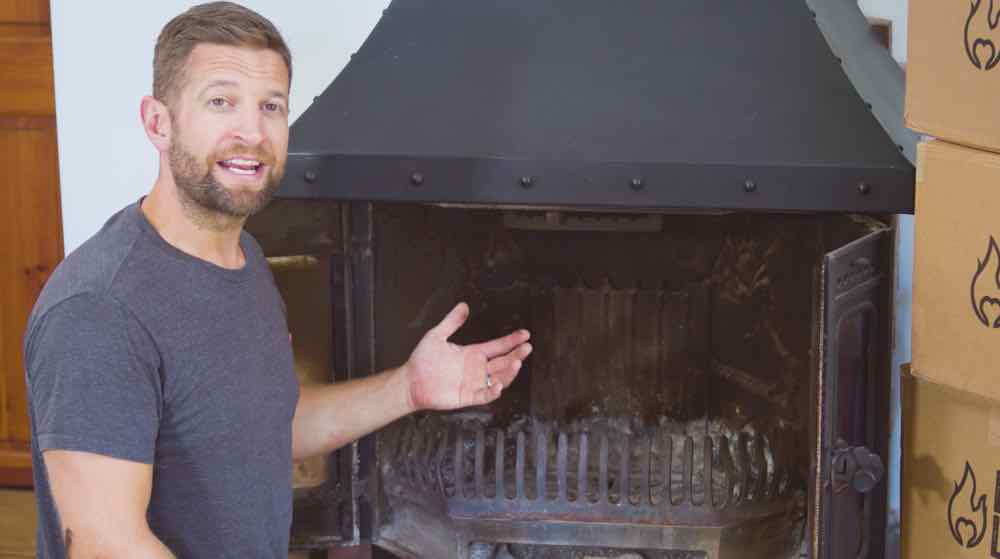 Paul next to a log burner