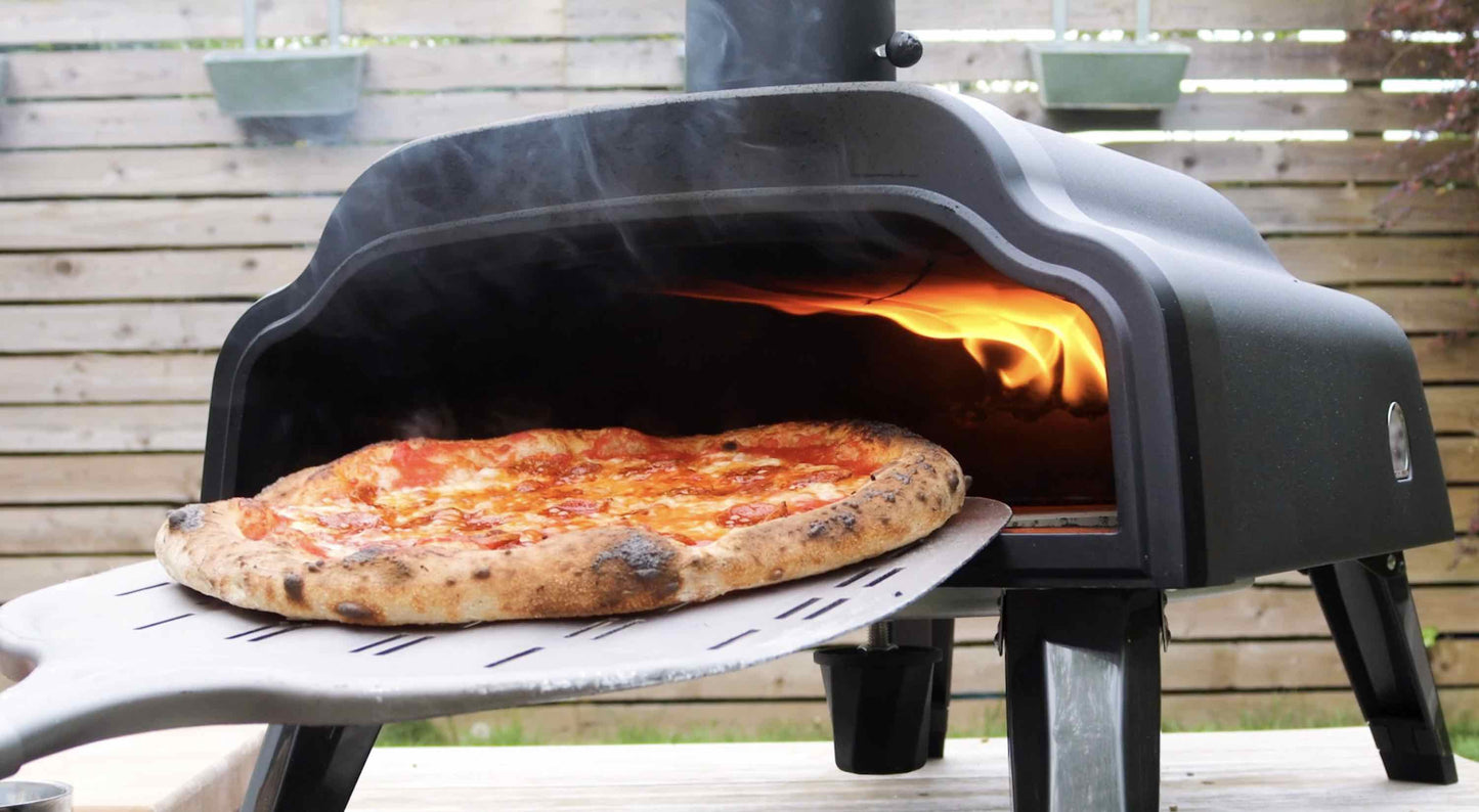 A wood fired Neapolitan Margherita pizza baked in the Thord pizza oven, also shown