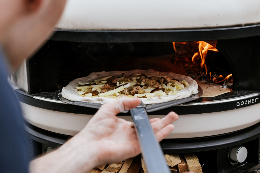 Pizza cooking in Gozney Dome pizza oven