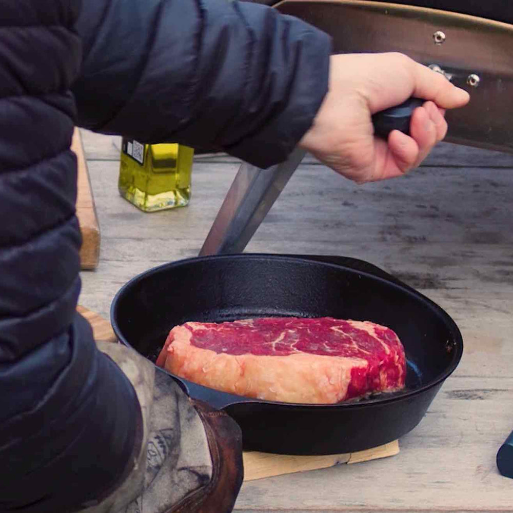 Close up of Steak Being Placed into Ooni Pizza Oven