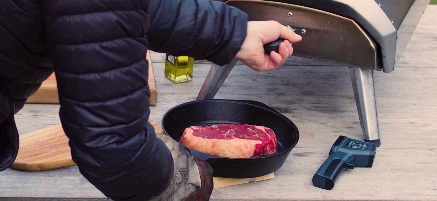 Close up of Steak Being Placed into Ooni Pizza Oven