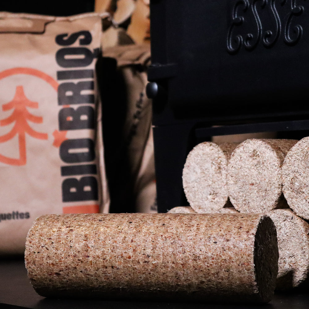 
                      
                        Bio Briqs firewood briquette unpacked in front of log burner and bag
                      
                    