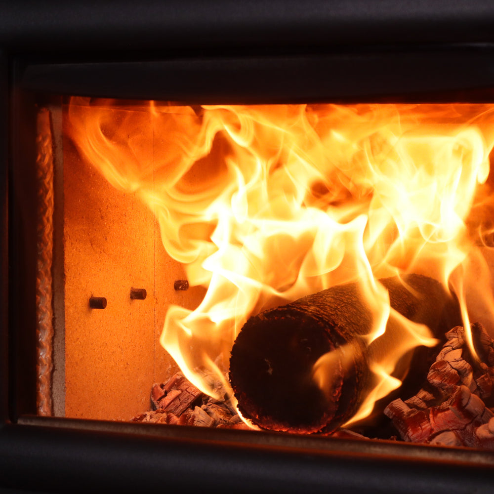 
                      
                        Bio Briqs firewood briquette fully on fire in a log burner
                      
                    