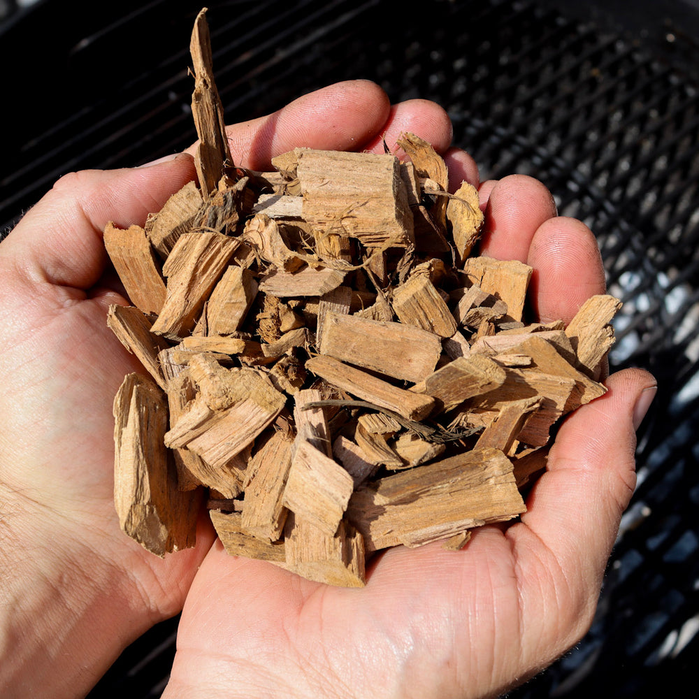 
                      
                        Love Logs British apple smoking chips held in cupped hands
                      
                    