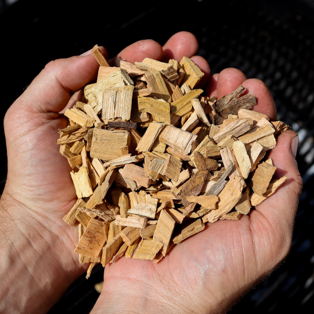 Love Logs British cherry smoking chips held in cupped hands