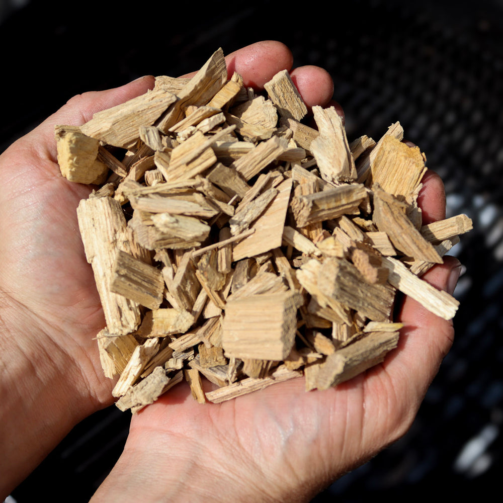 
                      
                        Love Logs British oak smoking chips held in cupped hands
                      
                    