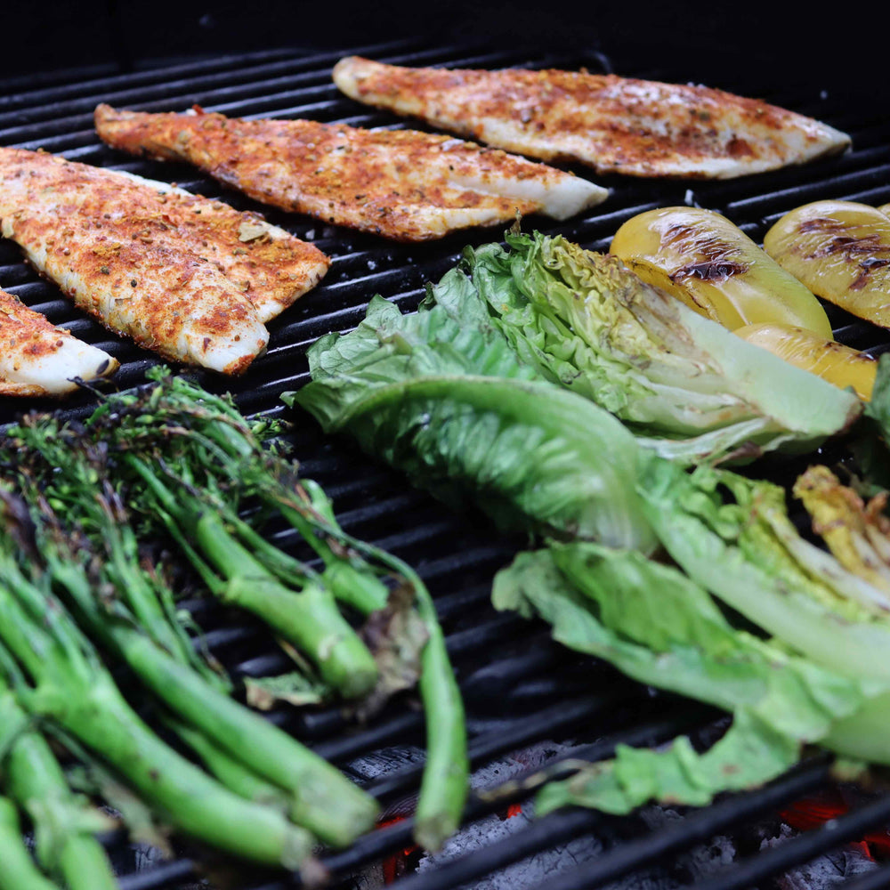 
                      
                        Food Being Grilled Over Love Logs Sustainable British Charcoal
                      
                    