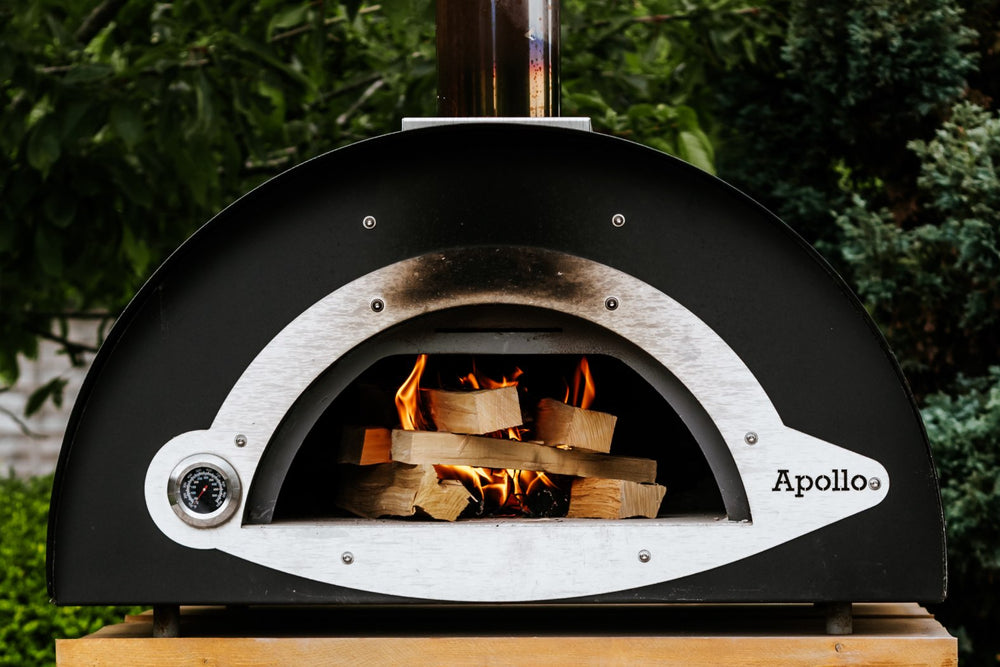 Love Logs Pizza Oven Wood Lighting in a Steel Pizza Oven