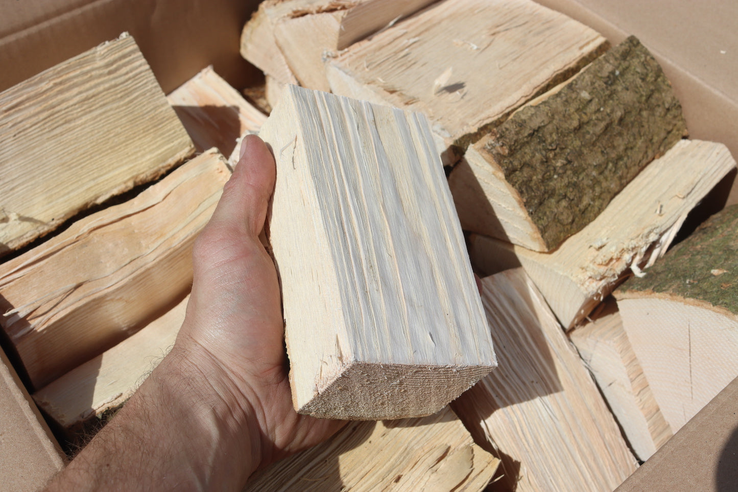 Photo showing a large box of British kiln dried hobbit logs for small wood burning stoves